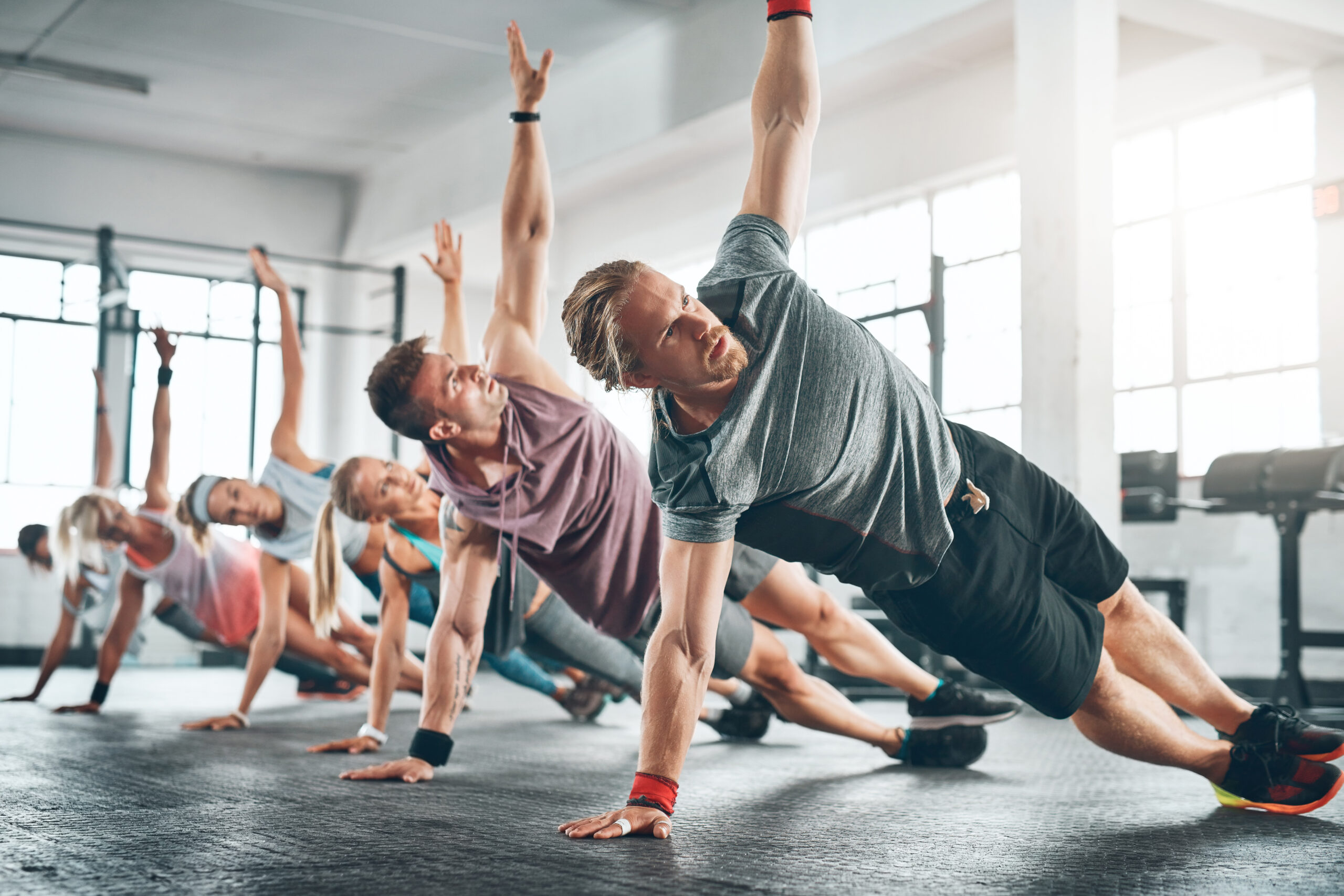 Make time for it. Shot of a fitness group working out at the gym